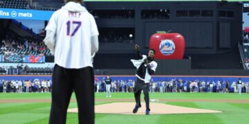 St. John's star Ian Jackson throws the ceremonial first pitch to teammate Ruben Prey before the Mets' 4-2 win over the Marlins on July 31, 2026 at Citi Field.