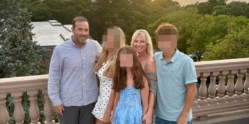 Brian Malloy (far left) pictured with his wife Luiza Malloy (2nd from right) and their children.
