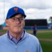 New York Mets owner Steve Cohen wearing a blue Mets cap and light blue zipped sweater at Spring Training.