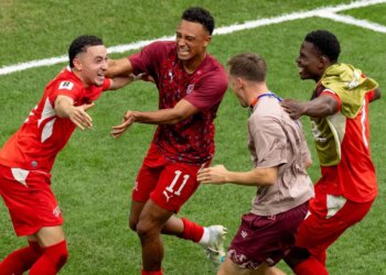 Ruben Vargas (left) celebrates with teammates after scoring the game-winning score on a penalty kick in a 4-3 shootout win over Colombia after a scoreless draw in their World Cup Round of 16 match on July 7, 2026 in Vancouver, British Columbia.
