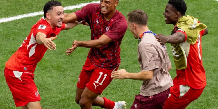 Ruben Vargas (left) celebrates with teammates after scoring the game-winning score on a penalty kick in a 4-3 shootout win over Colombia after a scoreless draw in their World Cup Round of 16 match on July 7, 2026 in Vancouver, British Columbia.