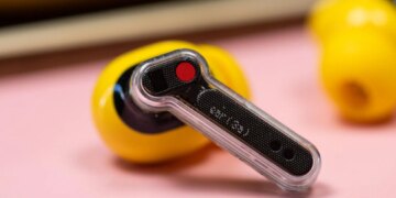 The Nothing Ear 3A earbuds on a mauve background with their case.