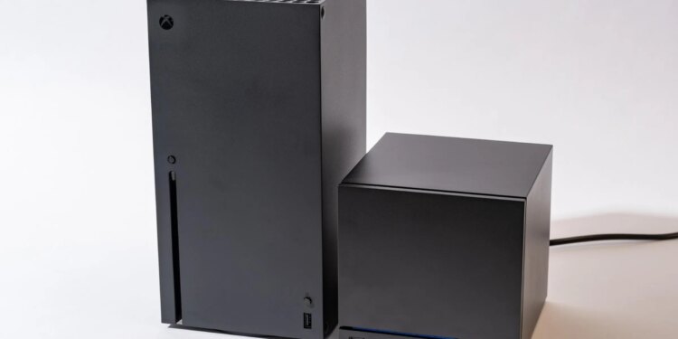 An Xbox Series X next to a Steam Machine. The Steam Machine is roughly half the size of the Series X.