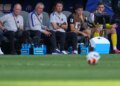 Christian Pulisic and other US players watching from the bench during the World Cup round of 16 soccer match between the United States and Belgium.
