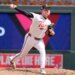 Minnesota Twins relief pitcher Cole Sands pitching in a baseball game.
