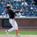 New York Mets center fielder Tyrone Taylor hitting a three-run home run.