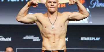 Bogdan Guskov of Uzbekistan poses on the scale during the UFC Fight Night ceremonial weigh-in at Etihad Arena on July 24, 2026 in Abu Dhabi, United Arab Emirates.