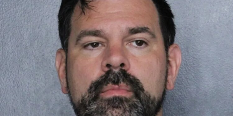 Mugshot of an equipment manager who was arrested.