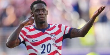 Folarin Balogun celebrating after scoring a goal for the United States.