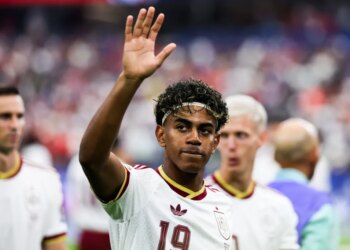 Lamine Yamal waves to the crowd at the FIFA World Cup semifinal match between France and Spain.