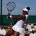 Venus Williams hitting a return at Wimbledon.