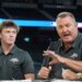 Jim Thome speaking at the MLB baseball combine with Landon Thome listening.