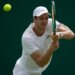 Hubert Hurkacz playing a backhand.