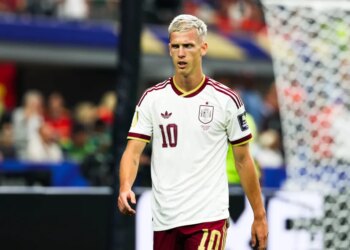 Dani Olmo of Spain, wearing a white and maroon jersey with the number 10, looking towards the right side of the frame during the FIFA World Cup semifinal match.