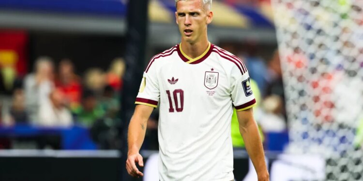 Dani Olmo of Spain, wearing a white and maroon jersey with the number 10, looking towards the right side of the frame during the FIFA World Cup semifinal match.