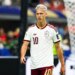 Dani Olmo of Spain, wearing a white and maroon jersey with the number 10, looking towards the right side of the frame during the FIFA World Cup semifinal match.