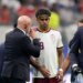 Spain coach Luis de la Fuente speaks to Spain's Lamine Yamal during a World Cup semifinal match.