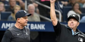 Aaron Boone (left) gets ejected by home plate umpire Doug Eddings during the sixth inning of the Yankees-Rays game on July 8, 2026 at Tropicana Field in St. Petersburg, Fla.