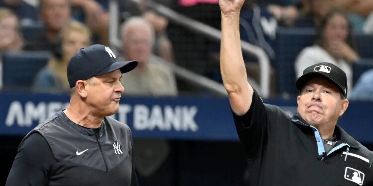 Aaron Boone (left) gets ejected by home plate umpire Doug Eddings during the sixth inning of the Yankees-Rays game on July 8, 2026 at Tropicana Field in St. Petersburg, Fla.