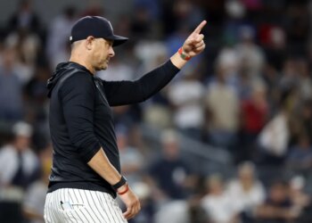 New York Yankees manager Aaron Boone signals for a pitching change in the ninth inning during the second baseball game of a doubleheader against the Pittsburgh Pirates, Wednesday, July 22, 2026, in New York.