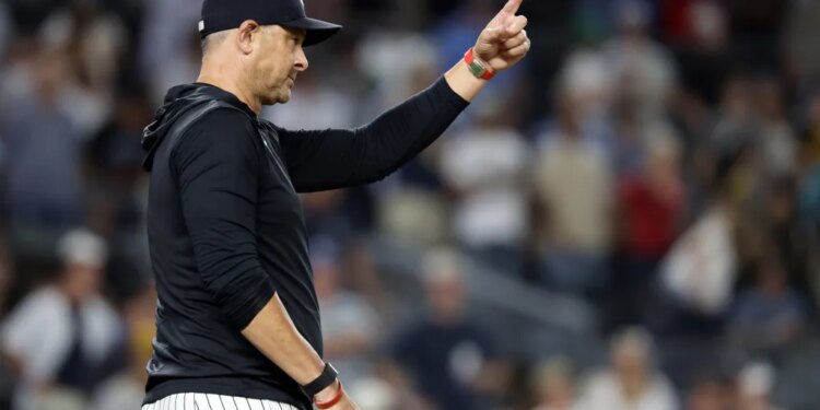 New York Yankees manager Aaron Boone signals for a pitching change in the ninth inning during the second baseball game of a doubleheader against the Pittsburgh Pirates, Wednesday, July 22, 2026, in New York.