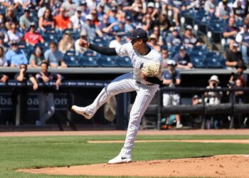 New York Yankees pitcher Carlos Lagrange #84 mid-pitch in the 1st inning.