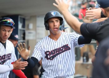 Somerset Patriots shortstop George Lombard Jr. #3, gets high-fives in the dugout after he scored from 3rd base on a sac-fly in the 1st inning on April 17, 2026.