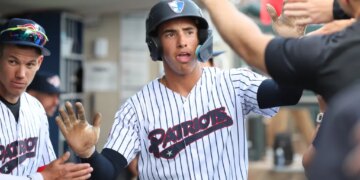 Somerset Patriots shortstop George Lombard Jr. #3, gets high-fives in the dugout after he scored from 3rd base on a sac-fly in the 1st inning on April 17, 2026.