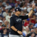 New York Yankees manager Aaron Boone signals for a pitching change.