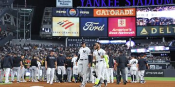 New York Yankees shortstop José Caballero #72 is walked back to the dugout after a scuffle with Pittsburgh Pirates pitcher Dennis Santana #60 and New York Yankees second baseman Jazz Chisholm Jr. #13 during the 8th inning at Yankee Stadium.