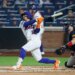 New York Mets shortstop Francisco Lindor (12) hits a two-run home run against the Atlanta Braves.
